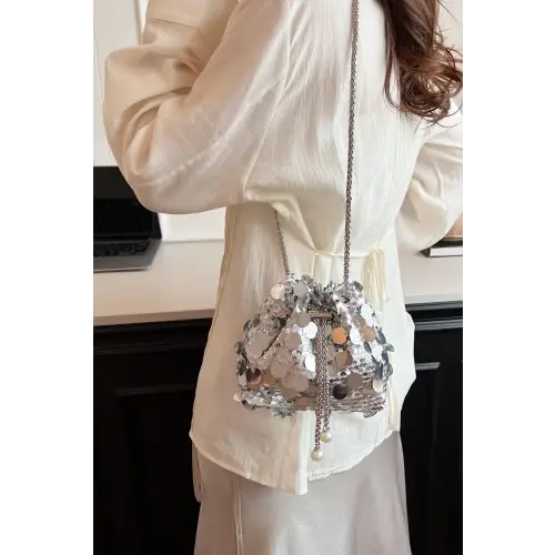 Shimmer in Style with the Drawstring Sequin Crossbody Bag