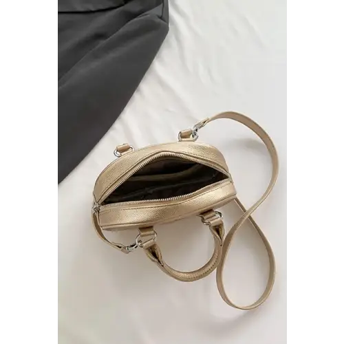 Stunning Gold Dome Leather Handbag Elevates Your Style