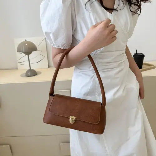 Stylish Brown Leather Shoulder Bag with Elegant Gold Clasp