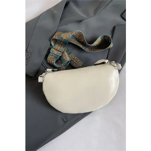 Stylish Leather Sling Bag with Unique Patterned Strap